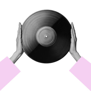 Two hands are lifting a black vinyl record against a transparent background. The focus is on the record which reflects light. This setting shows a simple yet striking contrast.