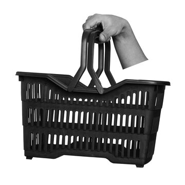 A hand is gripping the handle of a black plastic basket. The basket is versatile and can be used for carrying various items. It appears plain against a transparent background.