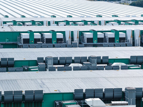 Aerial view of the Agriport A7 industrial greenhouse complex with rows of rooftops and ventilation systems in Middenmeer, Noord-Holland, Netherlands.