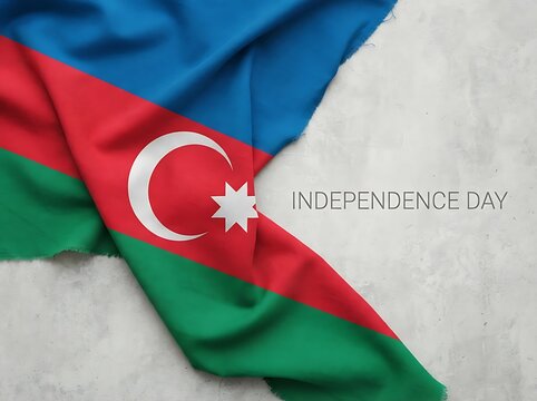 A realistic waved Azerbaijan national flag placed on grey textured background with Independence Day text.