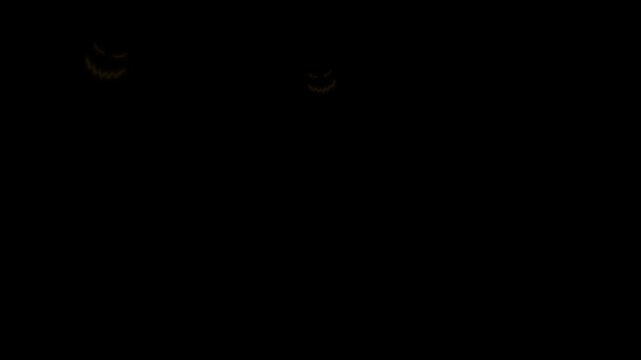 Pumpkin halloween animated multiple glowing jack o lantern faces appearing on black background.