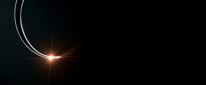 Abstract curved metal with glowing light flare