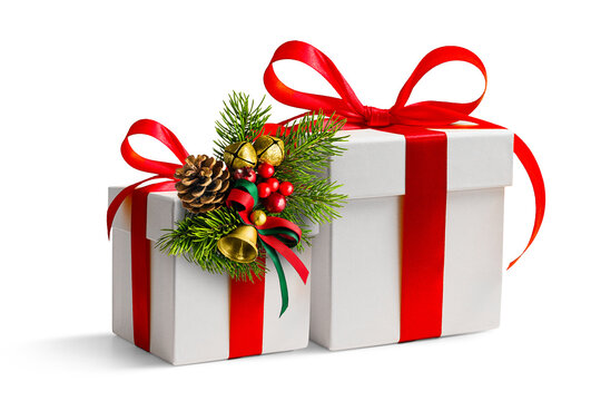 White gift boxes with red ribbon and christmas decorations