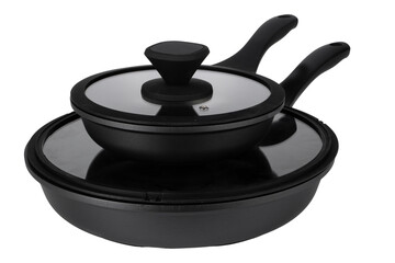 Fototapeta na wymiar Two black frying pans stacked with a lid, ready for cooking tasks in a kitchen
