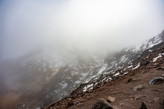 Misty snow-covered slopes of Cayambe volcano in Ecuador