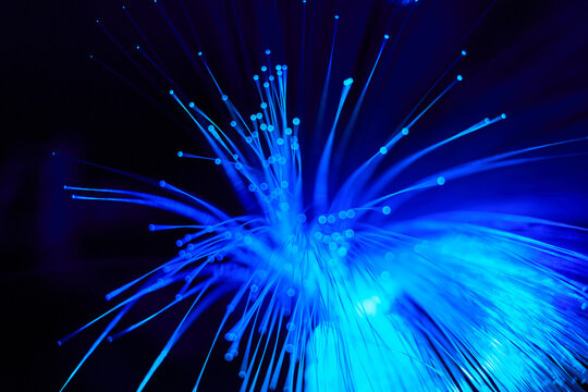 Blue fiber optic light abstraction on dark background