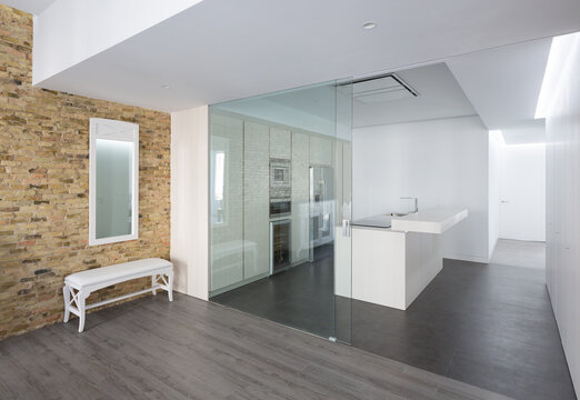 Luxury minimalist house interior with glass partition and stone wall