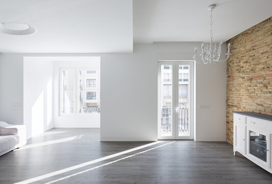 Luxury minimalist house interior with sunlight and brick wall