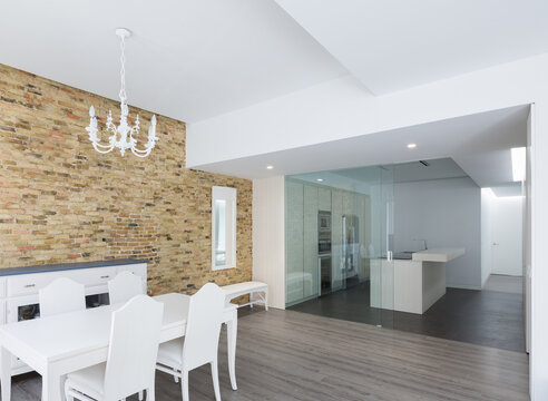 Luxury minimalist house interior with dining room and kitchen