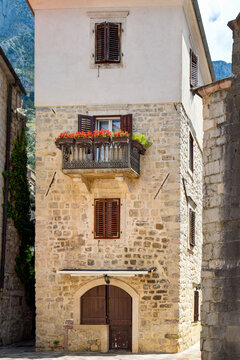 Historic stone house with balcony on a European tour