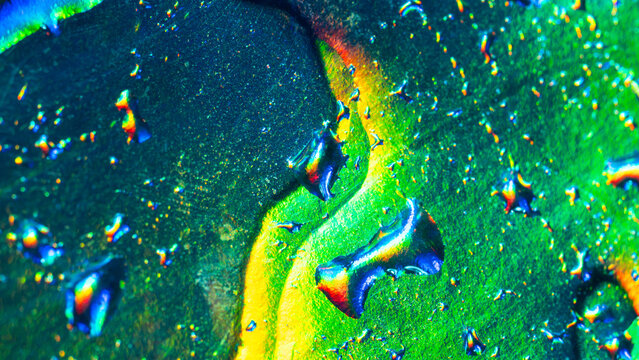 Abstract neon green and blue liquid texture with bubbles