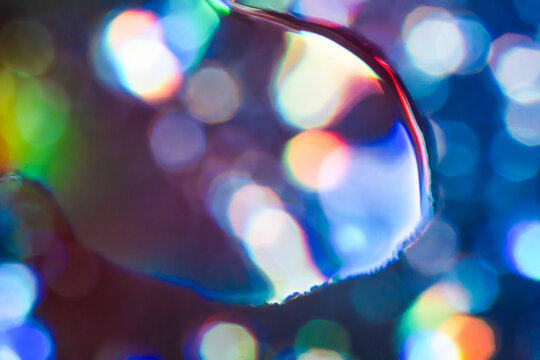 Abstract rainbow bokeh reflected in eyeglass lens