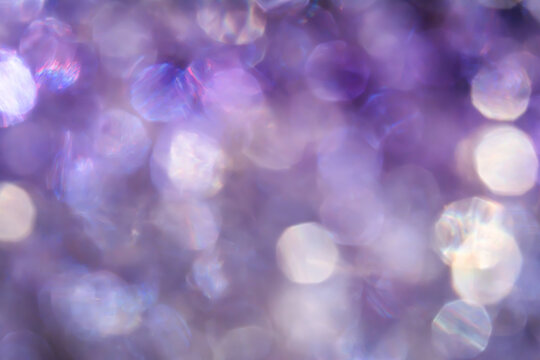 Abstract purple bokeh background with soft glowing light