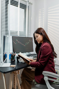 Financial analyst monitoring market trends and investment performance in modern office, representing stock trading, technical analysis, portfolio management and professional financial decision making.