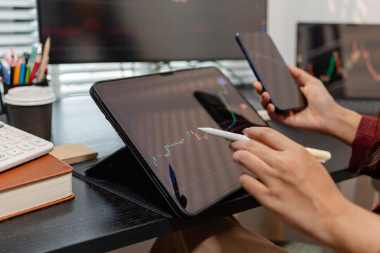 Professional trader monitoring financial markets and analyzing investment opportunities across multiple trading platforms, representing stock analysis, market research.