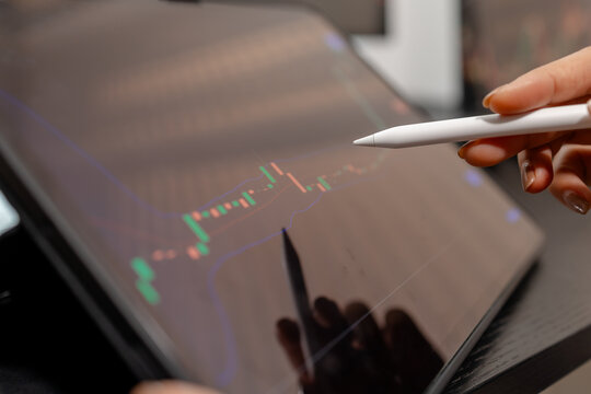 Professional trader monitoring financial markets and analyzing investment opportunities across multiple trading platforms, representing stock analysis, market research.