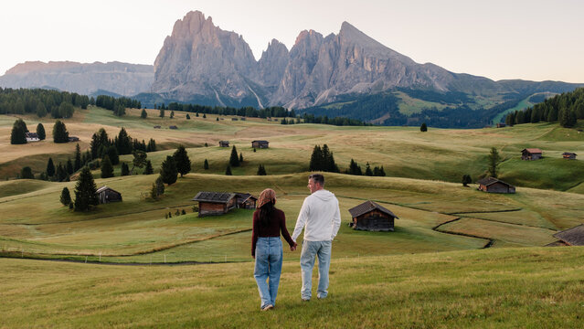 Romantic stroll through the lush meadows of Seiser Alm in the Dolomites, Italy