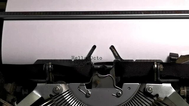 Close Up Overhead Shot of Vintage Typewriter Typing Hello October