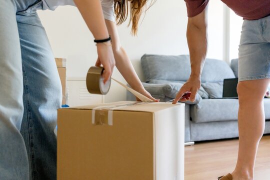 Couple pack cardboard box for home relocation