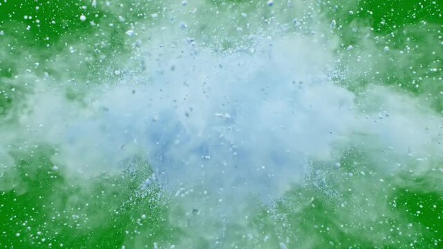 Water splash explosion with mist, vapor cloud, and droplets isolated on chroma key green screen background for video compositing and VFX