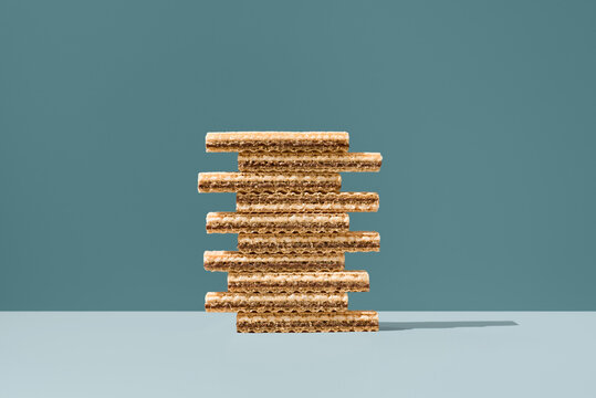 Stacked cream and chocolate wafer cookies on blue background