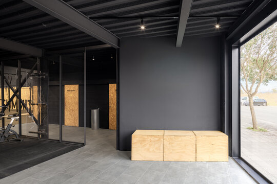 Modern CrossFit gym interior with wooden plyometric box