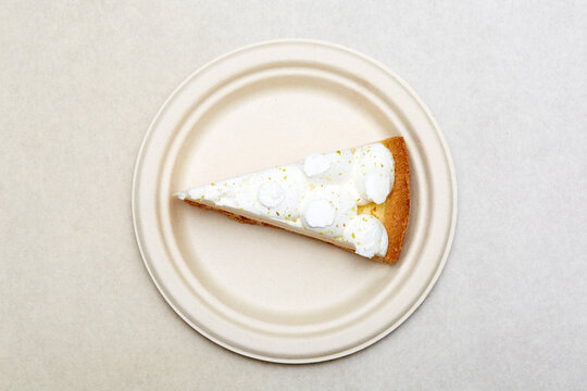 Italian ricotta tart slice with lemon zest on plate