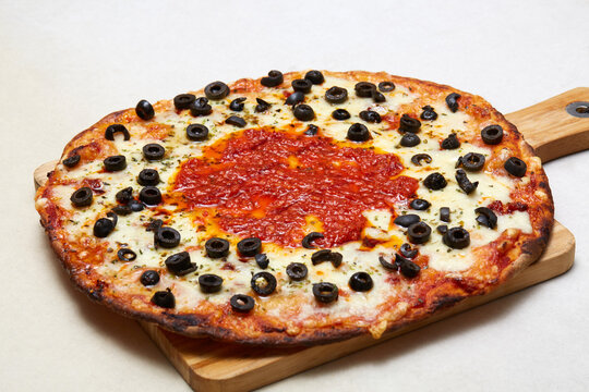 Italian pizza with mozzarella, olive and tomato sauce