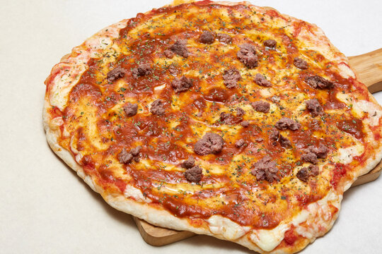 Homemade Italian beef pizza with melted cheese and sauce