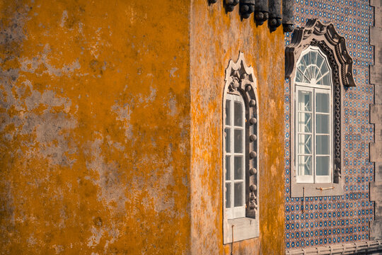 Ornate windows and azulejo facade at Pena palace, Sintra