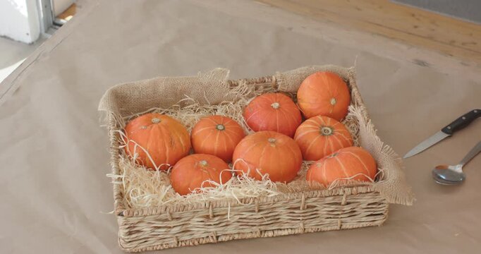 Camera is panning and zooming while tray is staying centered on table, showing halloween pumpkins