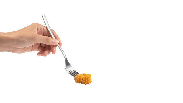 Crispy fried chicken nugget on a silver fork isolated on white background
