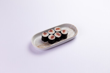 Tuna maki rolls on ceramic plate food preparation © Игорь Соколов