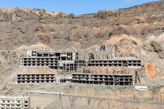 Ruins of abandoned building concrete hotel on Gran Canaria in Taurito, Spain