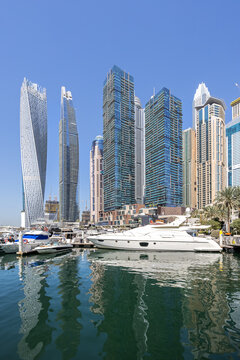 Dubai Marina skyline cityscape with yachts hotel skyscraper buildings living at water in Arabia