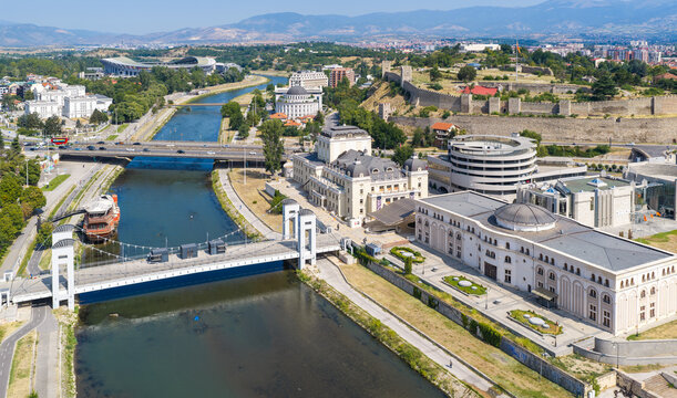 Aerial view of the Vardar River, the historic Skopje Fortress, the Macedonian National Theatre, and urban architecture in Skopje, Greater Skopje, North Macedonia.