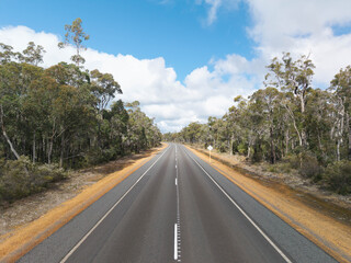 Fototapeta premium Aerial view of a rural road through bushland on Kangaroo Island, South Australia