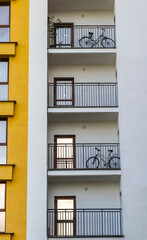 Obraz premium Modern apartment building balconies with parked bicycles. Concept