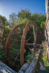 Ancient rusted water wheel at derelict mill in Tregargus Valley Cornwall © Coastal Drone Photo