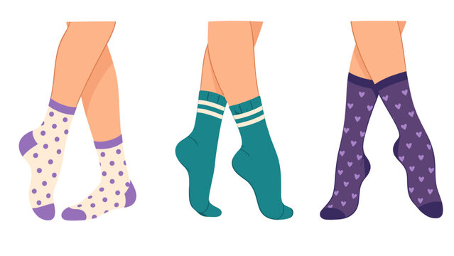 Three pairs of legs wearing colorful patterned socks