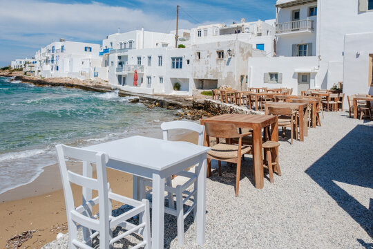 Charming streets of Naousa, Paros, Greece, reveal sunny cafes and vibrant atmosphere