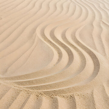 Minimalism and zen meditation, sand ripples with flowing lines for mindfulness and relaxation background in a natural desert landscape or beach setting