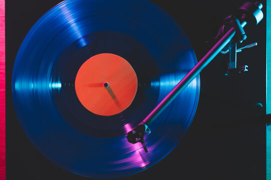 Turntable playing blue vinyl record