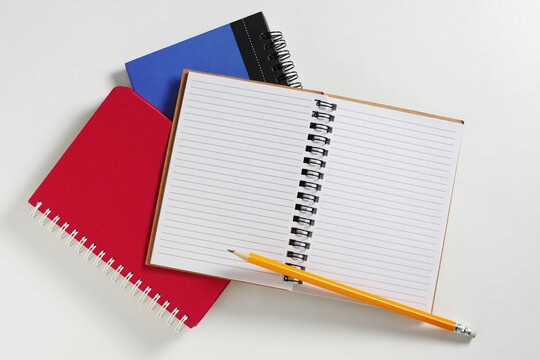 Open Notebook with Pencil Overhead