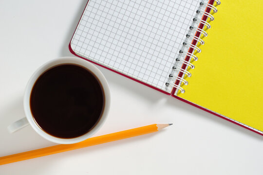Coffee, Notebook and Pencil Flatly