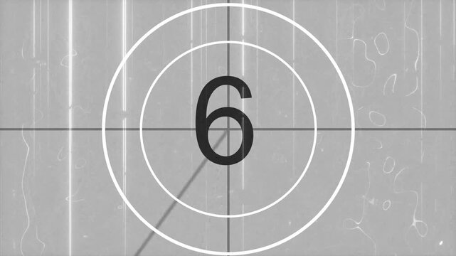 Vintage film leader countdown from 10 to 0 seconds. Vintage, old, projected film head leader with realtime countdown clock overlay. 4k loop