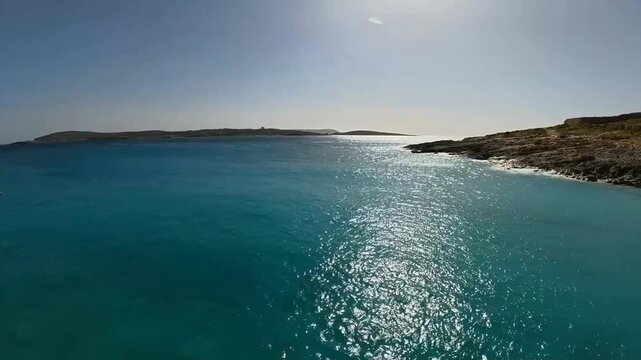 The Gozo channel, the islands of Comion and Cominetto. Viewed from Hondoq ir - Rummien Bay, on the Mediterranean island of Gozo in the Maltese Archipelago. 