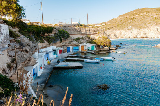 Charming Mandrakia in Milos, Greece with colorful boathouses and serene waters