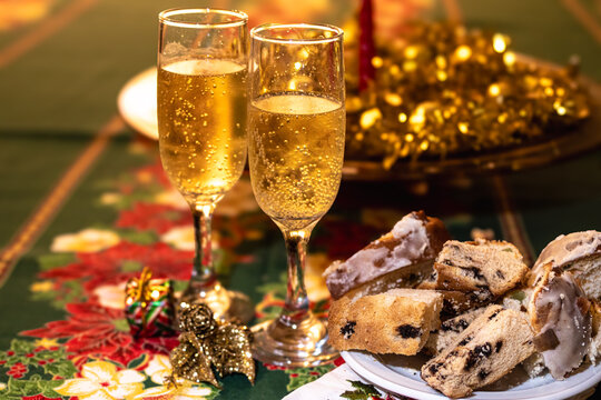 Celebrating Christmas and New Year with festive toasts, sparkling champagne flutes, holiday desserts, and decorative ornaments