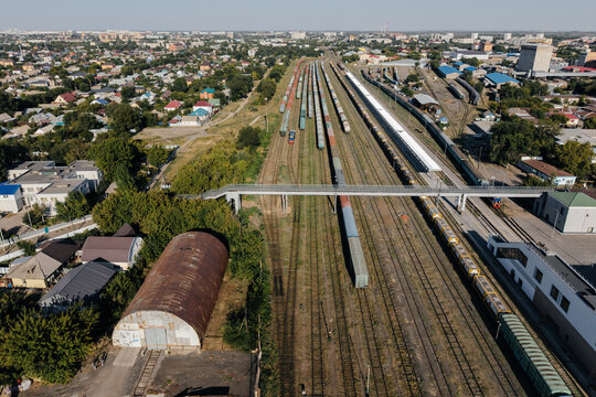 Aerial view of railway tracks passing through the urban landscape of Aktobe, Kazakhstan.

